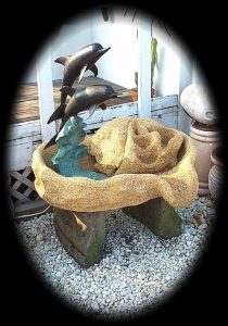 Dolphin spitter in a 3x4' base with top of heart fountain falls with lip to any exterior pool