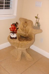Heart Ledged fountain on Pi Pedestal with client's art work on ledges